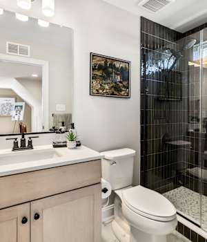 A Maple Bath featuring Galena Square cabinet doors in Shale from Wellborn Cabinet, Inc.
