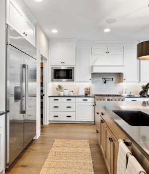 A Maple Kitchen featuring Lexington cabinet doors in Glacier and River Rock from Wellborn Cabinet, Inc.