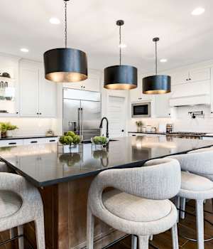 A Maple Kitchen featuring Lexington cabinet doors in Glacier and River Rock from Wellborn Cabinet, Inc.