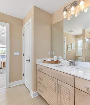 A Maple Bath featuring Antigua cabinet doors in Boardwalk from Wellborn Cabinet, Inc.