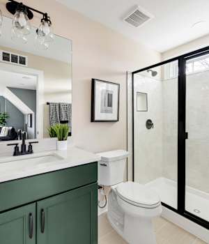 A Maple Bath featuring Henlow Square cabinet doors in Celtic from Wellborn Cabinet, Inc.