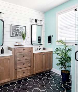 A Maple Bath featuring Hanover cabinet doors in River Rock from Wellborn Cabinet, Inc.