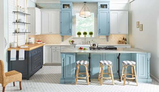 Light blue and white shaker kitchen cabinets with island