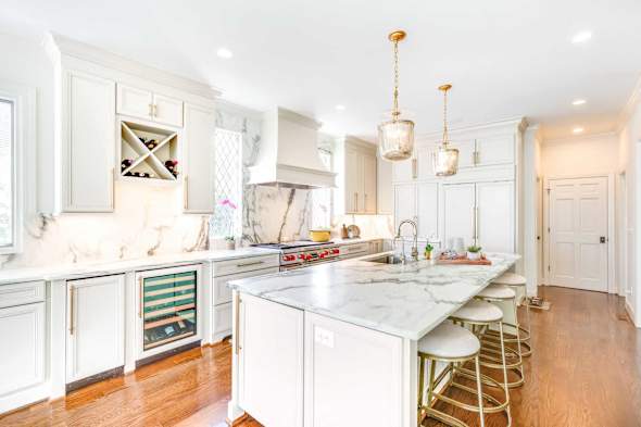 White kitchen cabinets with white island with white island end panels