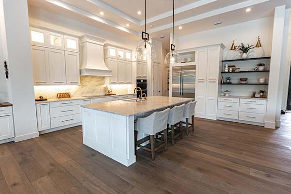 A Medium Density Fiberboard Kitchen featuring Bishop cabinet doors in Glacier from Wellborn Cabinet, Inc.