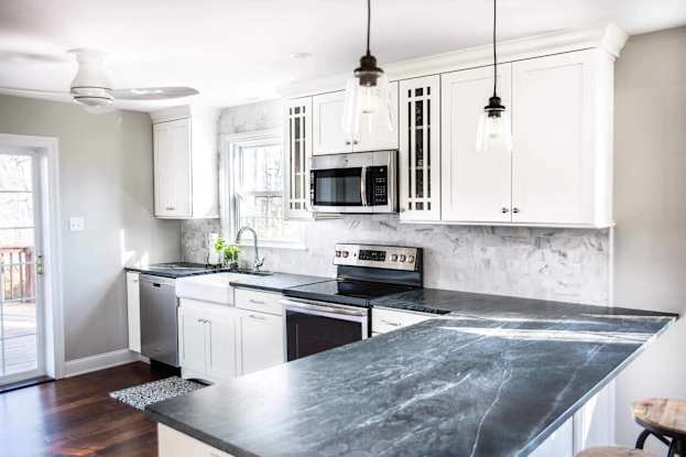 white shaker style cabinetry in kitchen small kitchen
