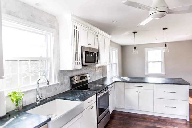 white shaker style cabinetry in kitchen small kitchen
