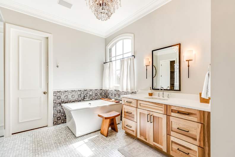 A Hickory Bath featuring Hanover cabinet doors in Natural from Wellborn Cabinet, Inc.