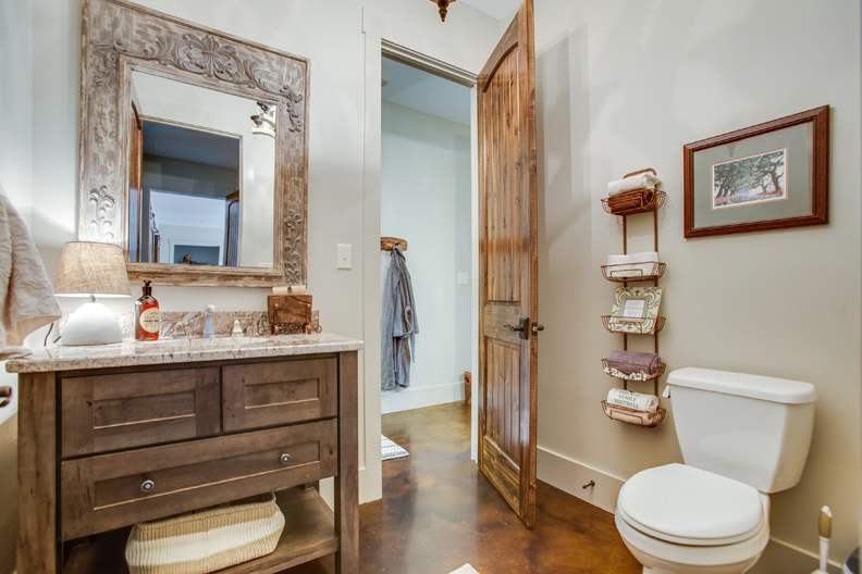 A Character Maple Bath featuring Hanover cabinet doors in Drift from Wellborn Cabinet, Inc.