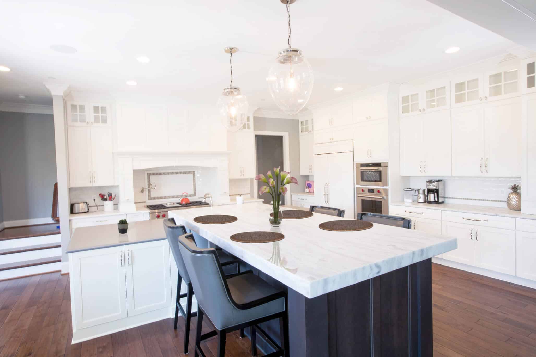 white kitchen with natural island