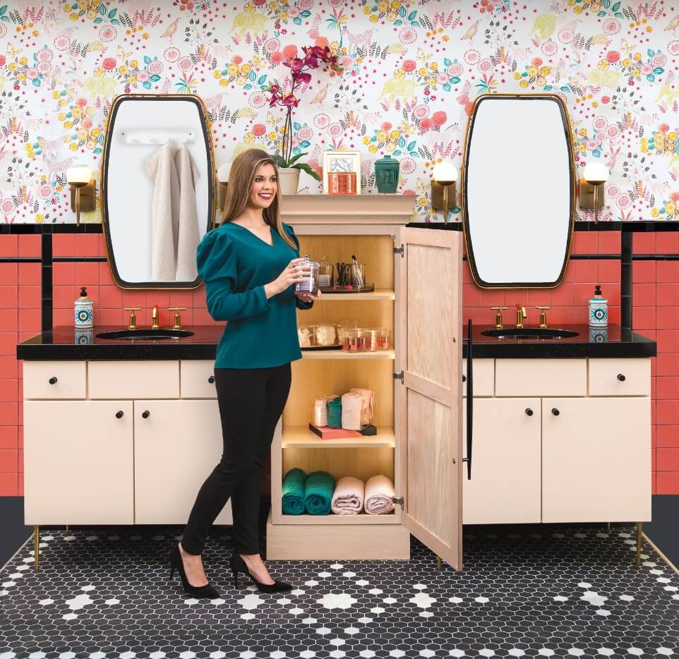 light pink color double bath vanities with pink and black tile and funky wallpaper