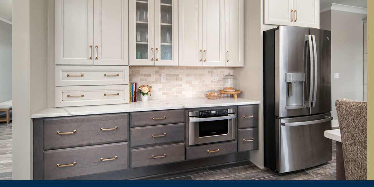 a remodeled white and gray kitchen using Wellborn cabinets