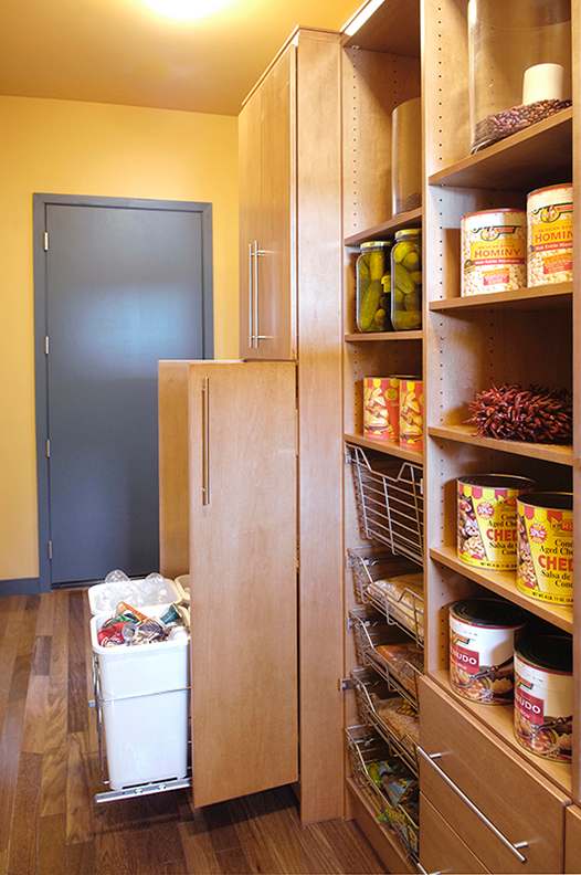 A Maple Pantry featuring Milan cabinet doors in Ginger from Wellborn Cabinet, Inc.