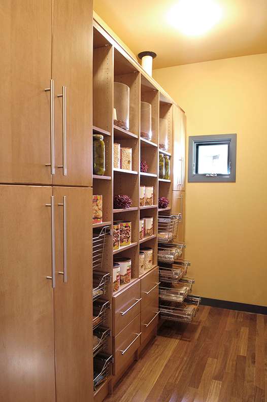 A Maple Pantry featuring Milan cabinet doors in Ginger from Wellborn Cabinet, Inc.