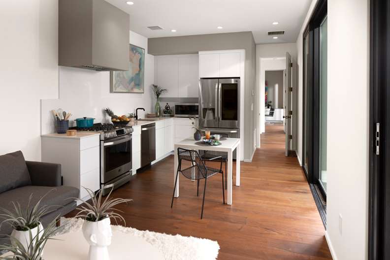 Midtown is Decorative Laminate Veneer Door door group with a Slab cabinet door from Wellborn Cabinet.