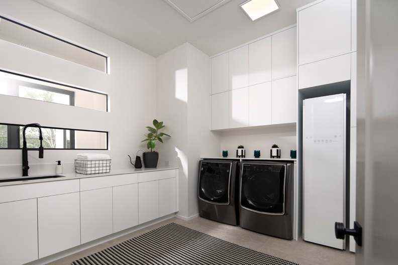 Midtown is Decorative Laminate Veneer Door door group with a Slab cabinet door from Wellborn Cabinet.