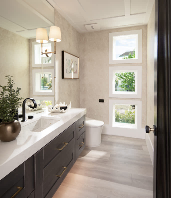 These Light and Brown cabinets for the 2022 The New American Home home were provided by Wellborn Cabinet, Inc.