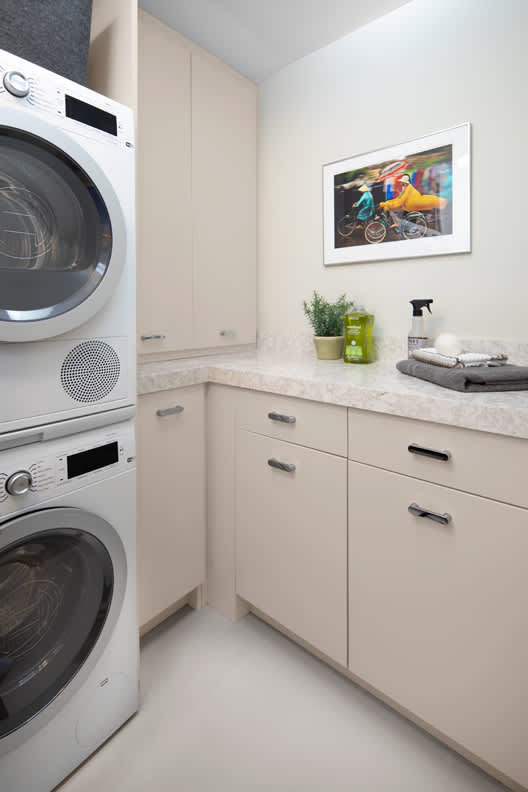 A Medium Density Fiberboard Laundry Room featuring Alto cabinet doors in Gray Mist from Wellborn Cabinet, Inc.